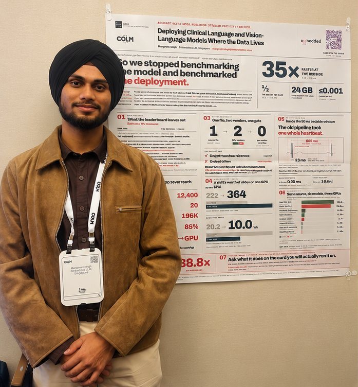 Manpreet next to his COLM poster